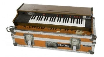 An Arp PE4 Electronic Music String Ensemble synthesizer in an orange Anvil road case stenciled "K-40 ICA tag 591 Jean-Luc Ponty."