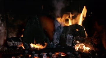 Relaxing Yuletide log? - Hold on, that's a guitar in flames!