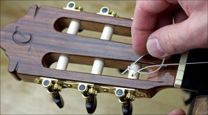 How to change strings on acoustic guitar