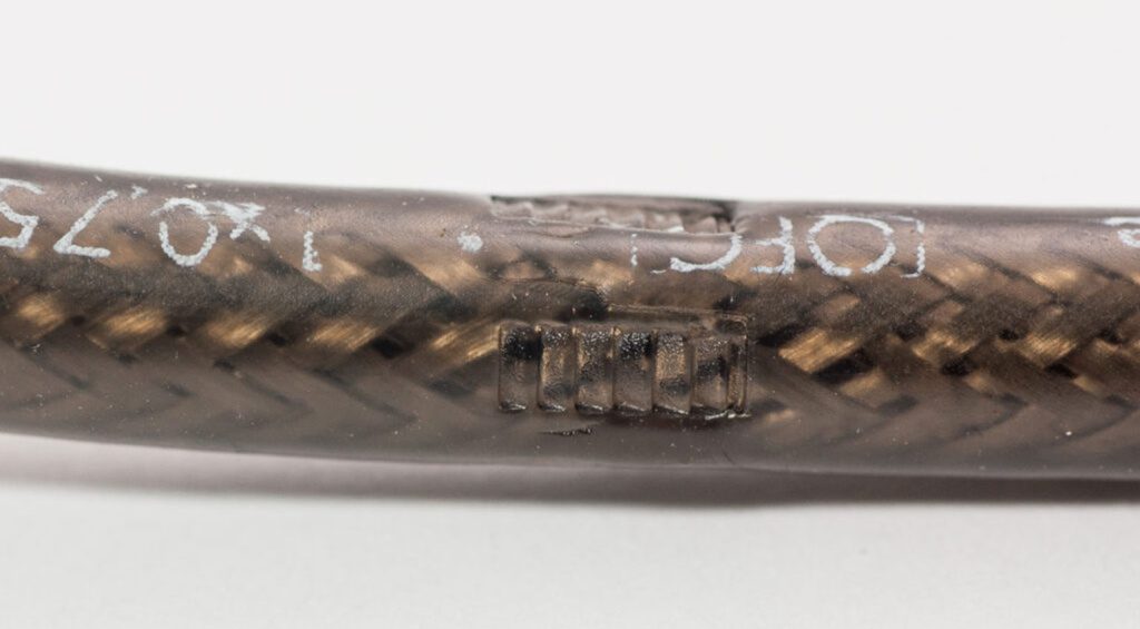 The marks on the cable sheath show how well the collet secures the cable.
